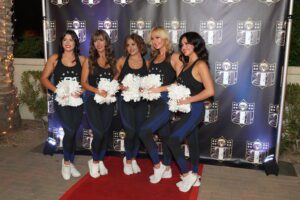 A group of women standing on the red carpet