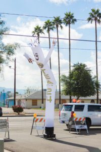 A white pole with a sign on it