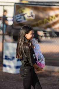 A woman holding a plastic bag in her hands.