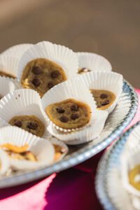 A plate of chocolate chip cookies on top of a table.