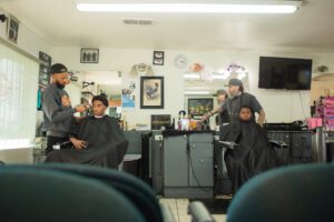 A group of men sitting in front of a television.