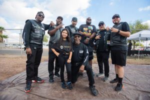 A group of people in black shirts and hats.