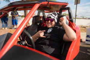 A man in the driver 's seat of an atv.