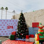 A christmas tree with presents and a lot of gifts