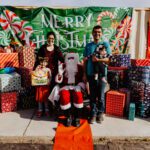 A family posing for a picture with santa claus.