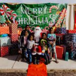 A group of children posing for a picture with santa.