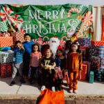 A group of children posing with santa claus.