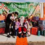 A group of people posing for a picture with santa.