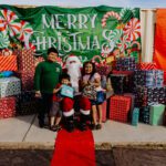 A group of people posing for a picture with santa.