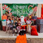 A group of children posing with santa clause.