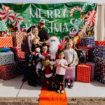 A group of people posing for a picture with santa.