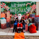 A group of people posing for a picture with santa.