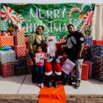 A family posing for a picture with santa claus.