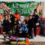 A group of people posing for a picture with santa.