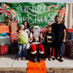 A group of people posing for a picture with santa.