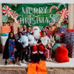 A group of people posing for a picture with santa.